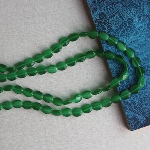 About 4.5x10x12mm oval cats eye glass beads,about 1.0mm in hole size,33 pieces per lot,factory price