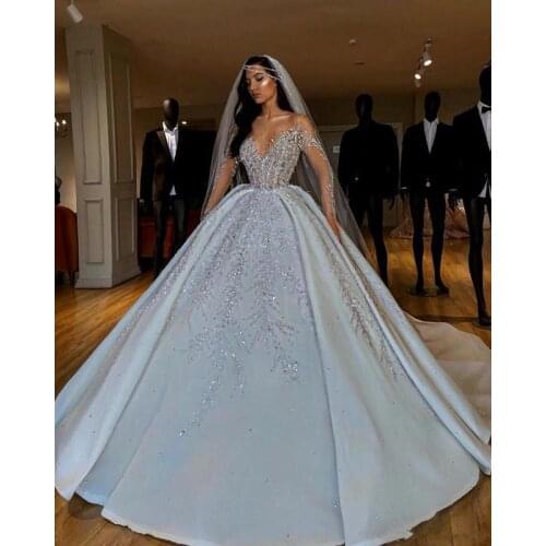 Luxurious Sparkly 2021 African Wedding Dresses Sheer Neck Long Sleeves Bridal Dresses Beaded Sequins Satin Wedding Gowns
