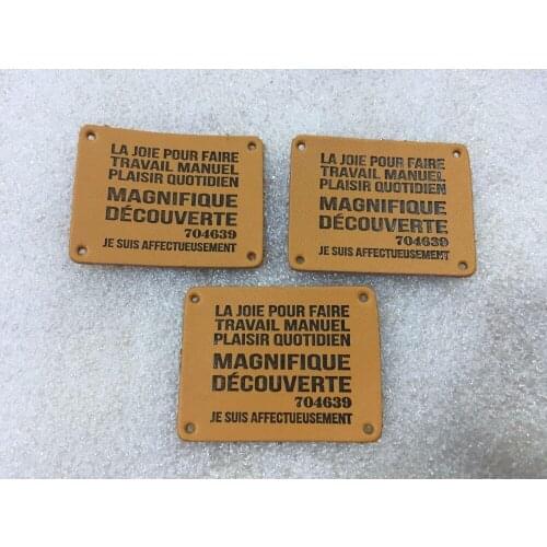 Custom leather labels for jeans, bags, shoes in high quality, artificial leather label, debossed/engraved logo