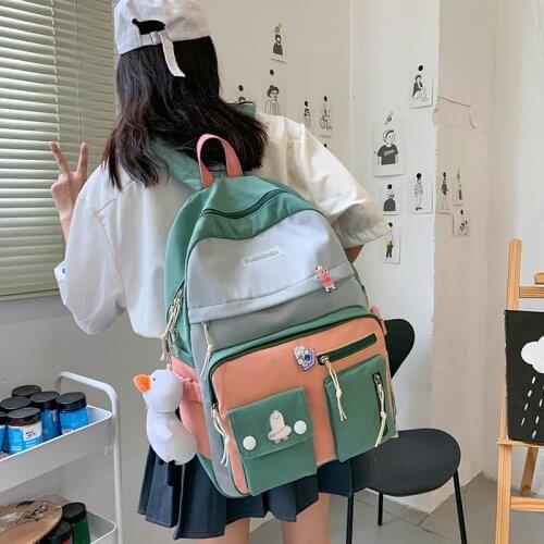 Fashion Womens Backpack Contrast Color Cute Doll Pendant School Bag For Girls Large School Backpack With Many Pockets 2021