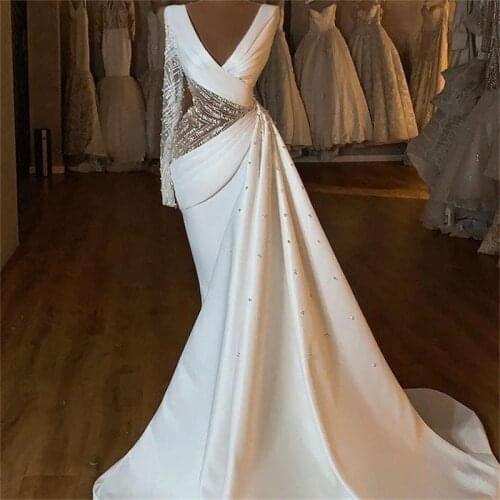 Arabic Aso Ebi 2021 Mermaid Beaded Crystals Wedding Gowns Deep V-neck Long Sleeves Satin Bridal Dresses