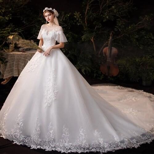 2021 New Simple Plus Size Pure White Lace Wedding Dress With Big Sweep Train O Neck Flare Sleeve Embroidery Bridal Dress