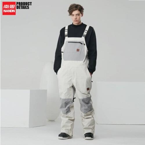NANDN Ski pants, snowboard ski strap pants, waterproof and wear-resistant fashion Men woman