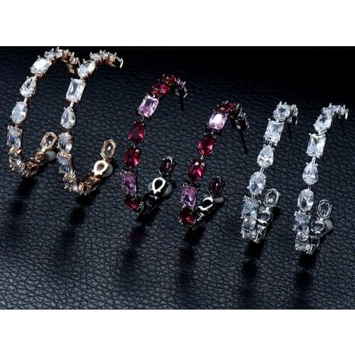 HIBRIDE Shiny Water Drop Cubic Zirconia Hoop Earrings for Women Trendy Circle Shape Party Show Holiday Shopping Jewelry E-879