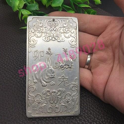 Pure white copper, twelve zodiac rabbit number plate on a vehicle