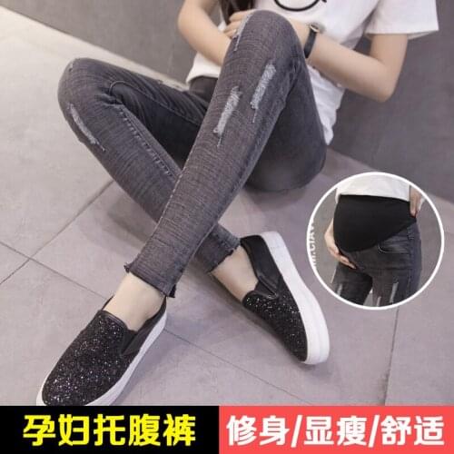 Pregnant women jeans fall maternity dress outside wearing trousers was thin feet nine points belly pants tide hole