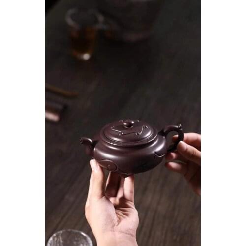 Purple clay pot famous teacher Peis pure manual raw material old purple clay carving three feet Ruyi home kungfu tea