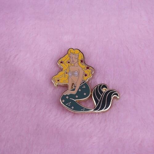 This beautiful mermaid pin is sure to add some sparkles to your wardrobe and show your love of the song of the siren