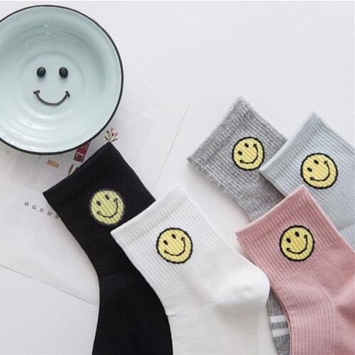 A pack of 1 pairs Hot sales Multicolor Sweet Smiley female socks Warm-tone Smiling face women tube sock