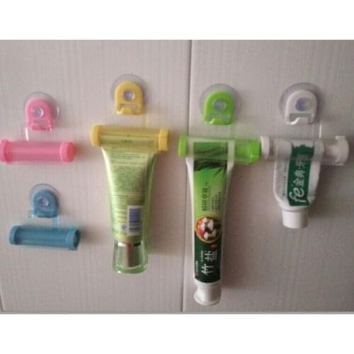 Fashion Hot Creative Rolling Squeezer Toothpaste Dispenser Tube Partner Sucker Hanging Holde