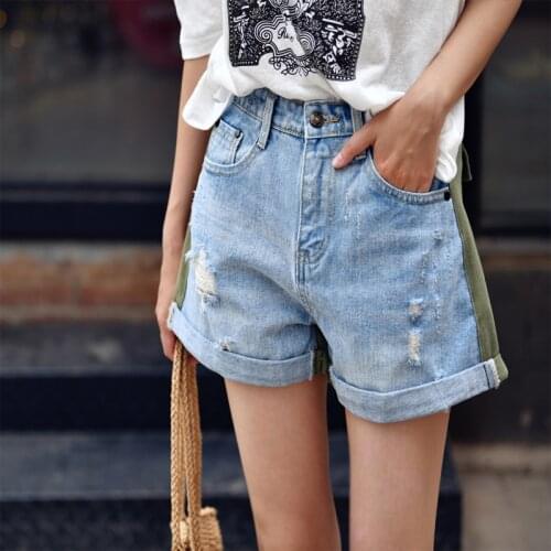 MICOCO N7062 Artistic style washed cotton magic hole contrast color flanged hot pants jean shorts