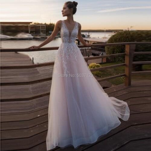 A Line Wedding Dresses Tulle Lace Appliques Sleeveless Deep V Neck Bridal Wedding Gown Vestido De Noiva with Court Train 2021