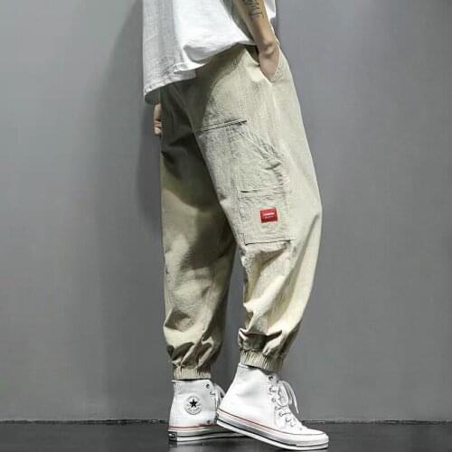 Unique Creative Mens Pants Fashion Hip Hop Cargo Pants 4 Seasons New Wide Leg Men Pants Hip Slant Pocket Reverse Behind Design