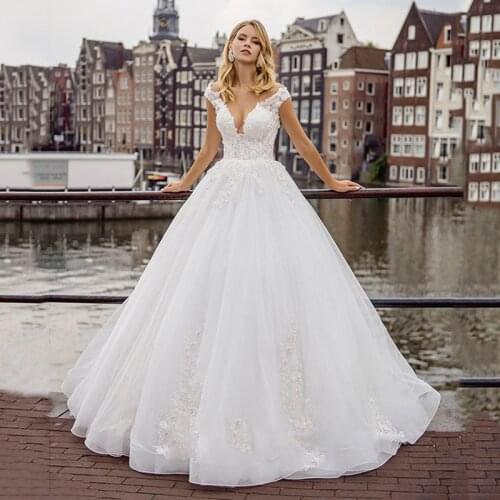 Modest V-neck Lace Appliques White Wedding Dresses Cap Sleeves Buttons Back Sweep Train Vestido de Noiva Bridal Gowns 2021