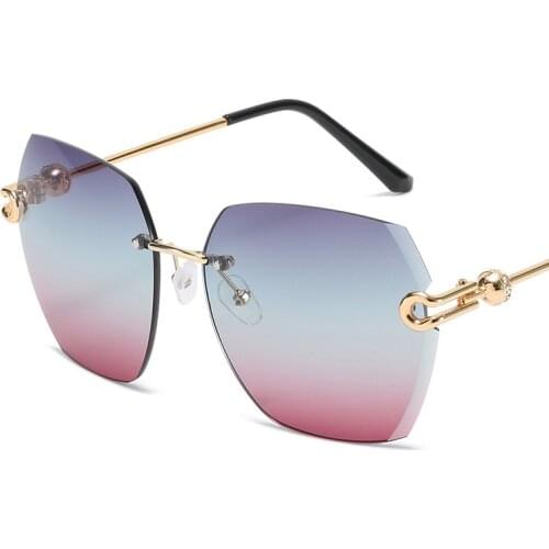 New European and American fashion sunglasses rimless diamond gradient metal glasses womens elegant large frame color glasses UV