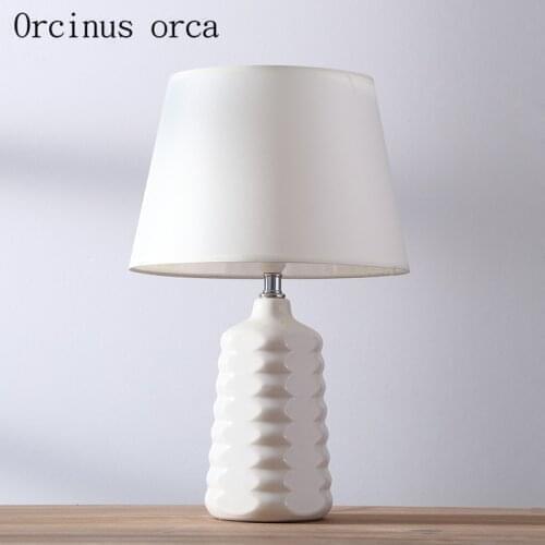 Nordic simple modern white table lamp bedroom warm bed lamp American creative ceramic decorative table lamp free shipping