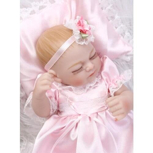 27CM Silicone reborn dolls miniature baby girl dolls with pretty pink dress pillow wedding gift kids bath toys bonecas