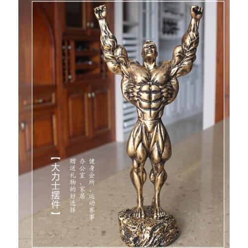 MUSCLE-BUILDING MAN PUTS TROPHY FOR BODYBUILDING COMPETITION FIGURE LOVELY DECORATION FURNISHINGS LOVERS MERRY CHRISTMAS HOME