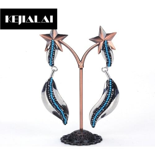 KEJIALAI Metal Punk Wicker Leaf Charm Pendant Earrings for Women Micro Paved with Blue Rhinestone Long Drop Earrings for Wedding