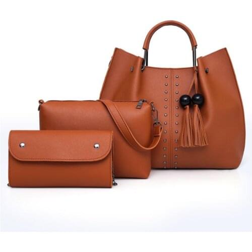 The new simple and fashionable handbag tote bag wild rivet shoulder bag large capacity diagonal bag three-piece female bag women