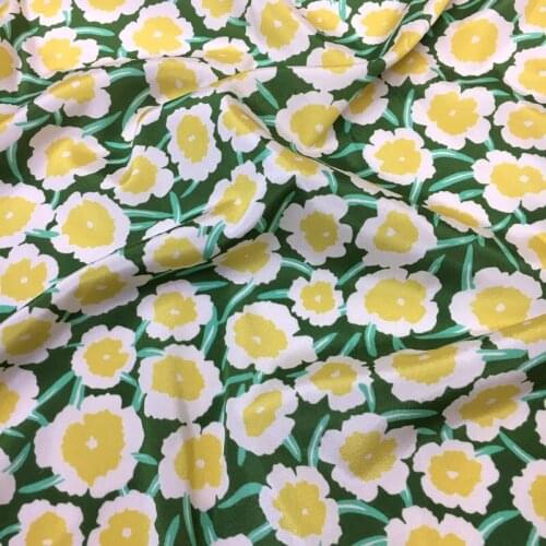 Hand-painted small yellow flower print green bottom elastic crepe de chine digital printing natural mulberry silk high fashion