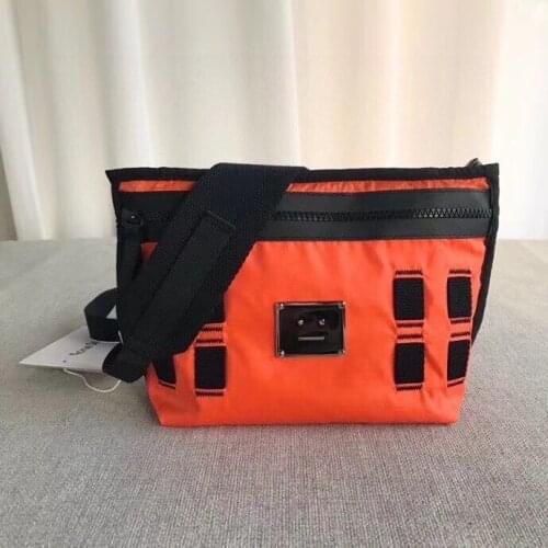 2021 new single shoulder bag metal name plate dumpling cross bag mens and womens single shoulder bag tide bag mobile phone bag