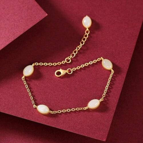 Natural Hetian white chalcedony bracelet Chinese style retro elegant craftsmanship gold oval charm ladies light luxury jewelry