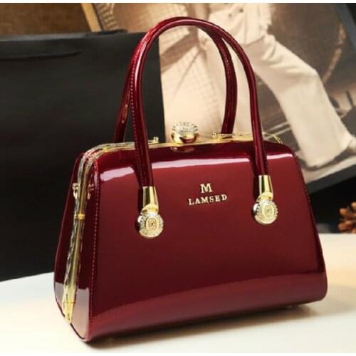 Simple atmosphere leather brand woman bag new work hand bill of lading shoulder slung