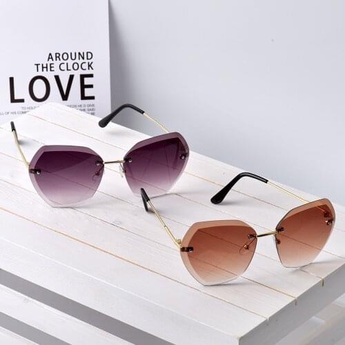 UEESHOP Rimless Womens Sunglasses Design Fashion Lady Sun glasses Vintage Alloy Classic Designer Shades UV400 Eyewear