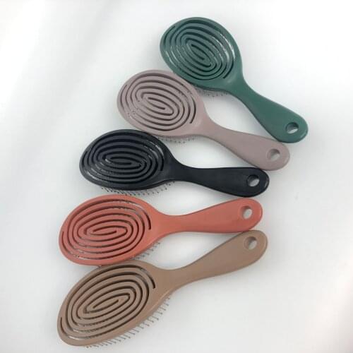 Hairbrush Multicolor Hollow mosquito coil shape hairdressing comb Curved comb Hollow curved plastic massage comb