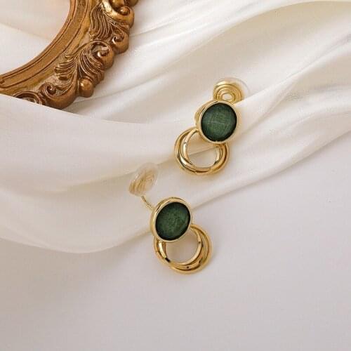 U-Magical Korean Green Mosquito Coil Clip Earrings for Women Temperamentcircle Entangled Metal Hollow Party Earrings Jewelry