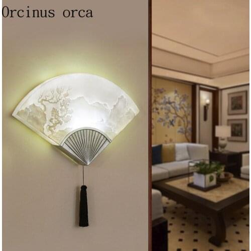 The new Chinese style relief fan wall lamp dining room balcony bedroom bedside lamp China wind resin creative wall lamp