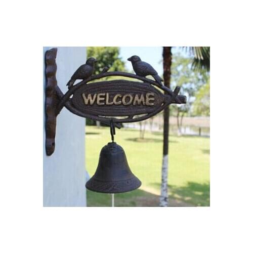 European American rural countryside vintage wrought iron doors welcom doorbell ringing bells in front of mural