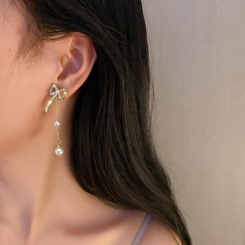 U-Magical Exquisite Bowknot Tassel Imitation Pearl Dangle Earrings for Women Shining Rhinestone Chain Hollow Earrings Jewelry