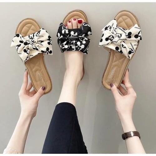 Disney net red 2021 summer sandals and slippers female bow fairy style ins tide Korean fashion popular one-word drag flat bottom