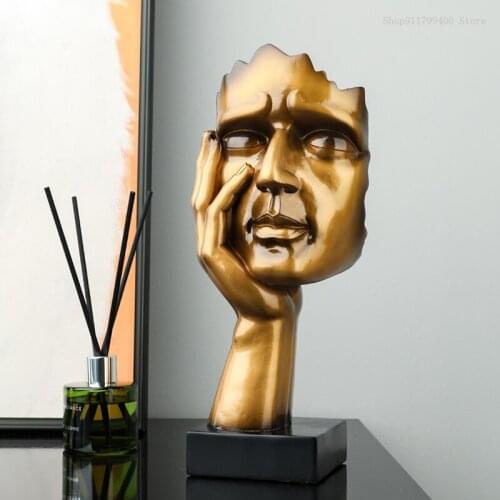 The statue of the golden thinker is antique, silence is the golden statue of home decoration, bookcase decoration