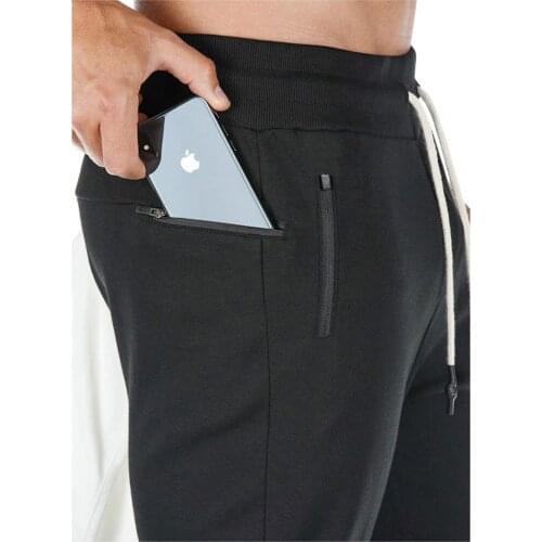 Mens fashion gym bodybuilding cotton sweatpants with towel rack and mobile phone pocket running pants casual jogger tights