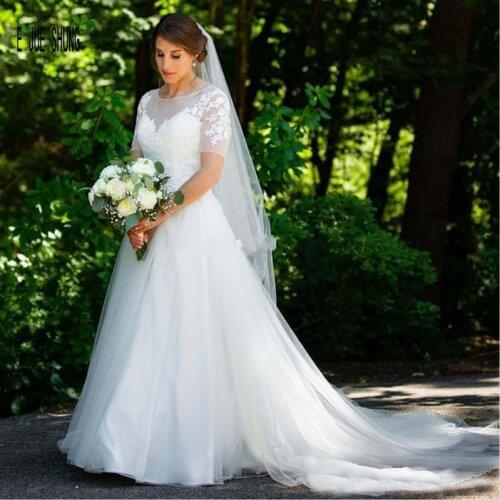 E JUE SHUNG 2020 Modest A Line Wedding Dresses Short Sleeve Sheer Scoop Neck Appliques Back Lace Up Country Style Bridal Gown