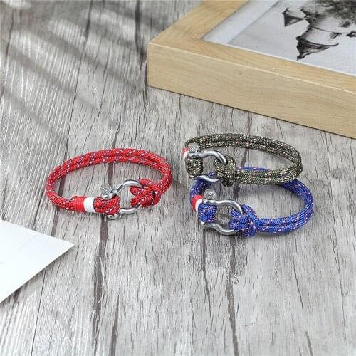 New outdoor personalitysteel button bow popular quick sell 550 umbrella rope bracelet Leather Strap Bracelet Europe and America