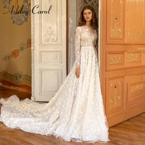 Ashley Carol A-Line Wedding Dress 2021 Charming Lace Appliques Bride Long Sleeve Semi-Transparent Scoop Shinny Beach Bridal Gown
