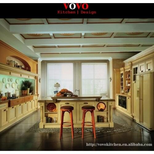 Antique wooden kitchen cabinet with an island for breakfast