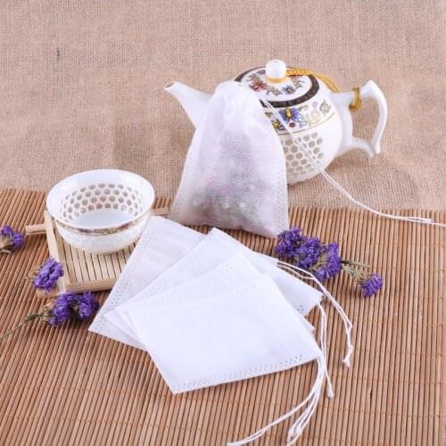 100Pcs tea Bags 5.5 x 7CM Non-woven Seal Filter Drawstring Pouch Multifunction Tea Bags Cook Herb Spice Tools Coffee Pouches