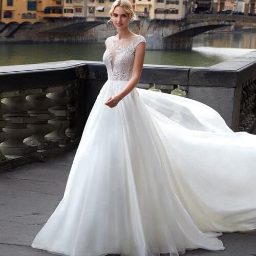 Graceful Cap Sleeve Ball Gown White Wedding Dresses 2021 Robe De Mariée Appliques Tulle Bridal Gowns with Court Train