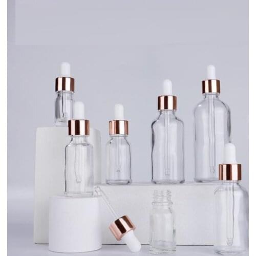 Wholesale clear serum glass dropper bottles 5ml 10ml 15ml 20ml 30ml 50ml 100ml with rose gold lid for essential oils SN544