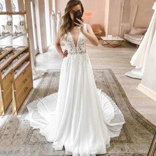 Charming On Sale 2021 Sleeveless Bridal Wedding Dresses V Neckline Appliqued Wedding Gowns for Bride Chiffon Court Train