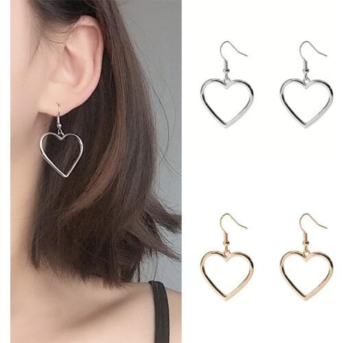 Design semplice orecchini pendenti a cuore cavo per le donne nuovo marchio moda orecchio polsino Piercing ciondola l'orecchino