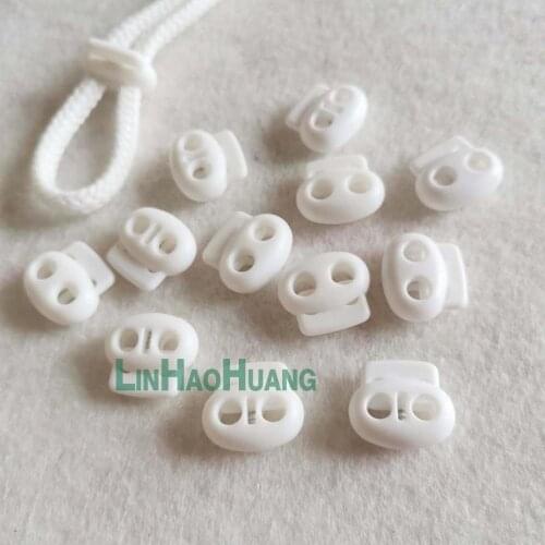 100pcs/lot white POM plastic ball cord lock toggles plastic 2 hole spring stoppers 4.5mm bungee shock cord free shipping