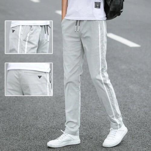 Summer casual pants mens ice silk thin trousers teen Korean version loose thin students a hundred small feet sweatpants