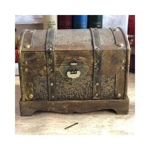 Antique and old, golden treasure chest, pirate box, wooden wooden box with lock, retro storage old storage box