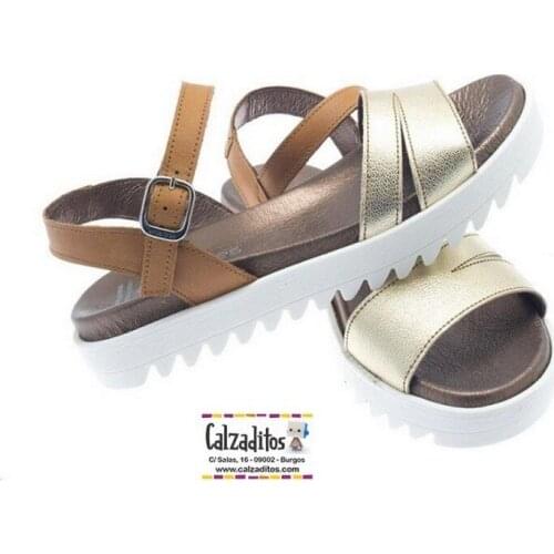 Leather & platinum color fur sandals with platform, from Andanines